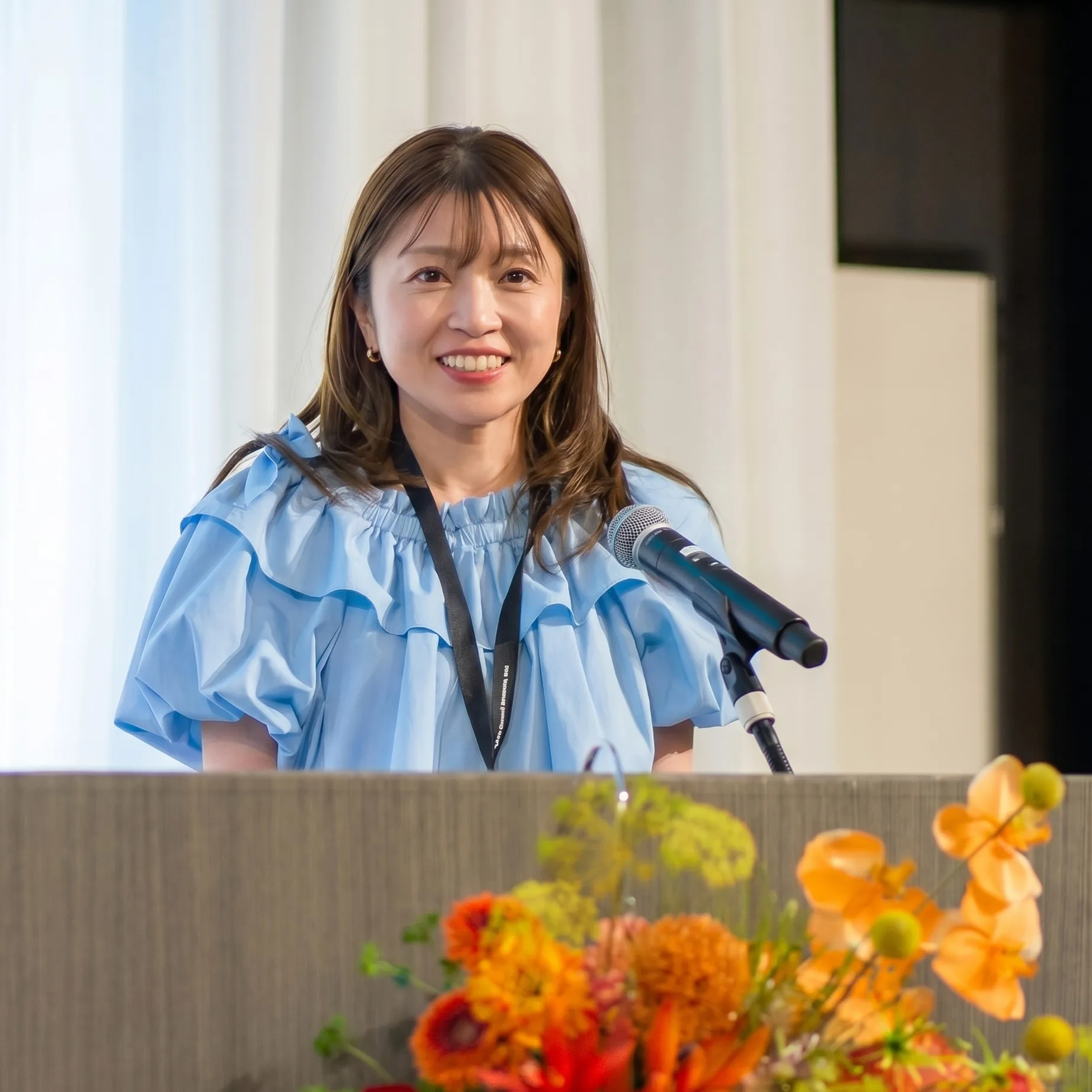 Re:Design株式会社 取締役 佐々木裕実が登壇する様子